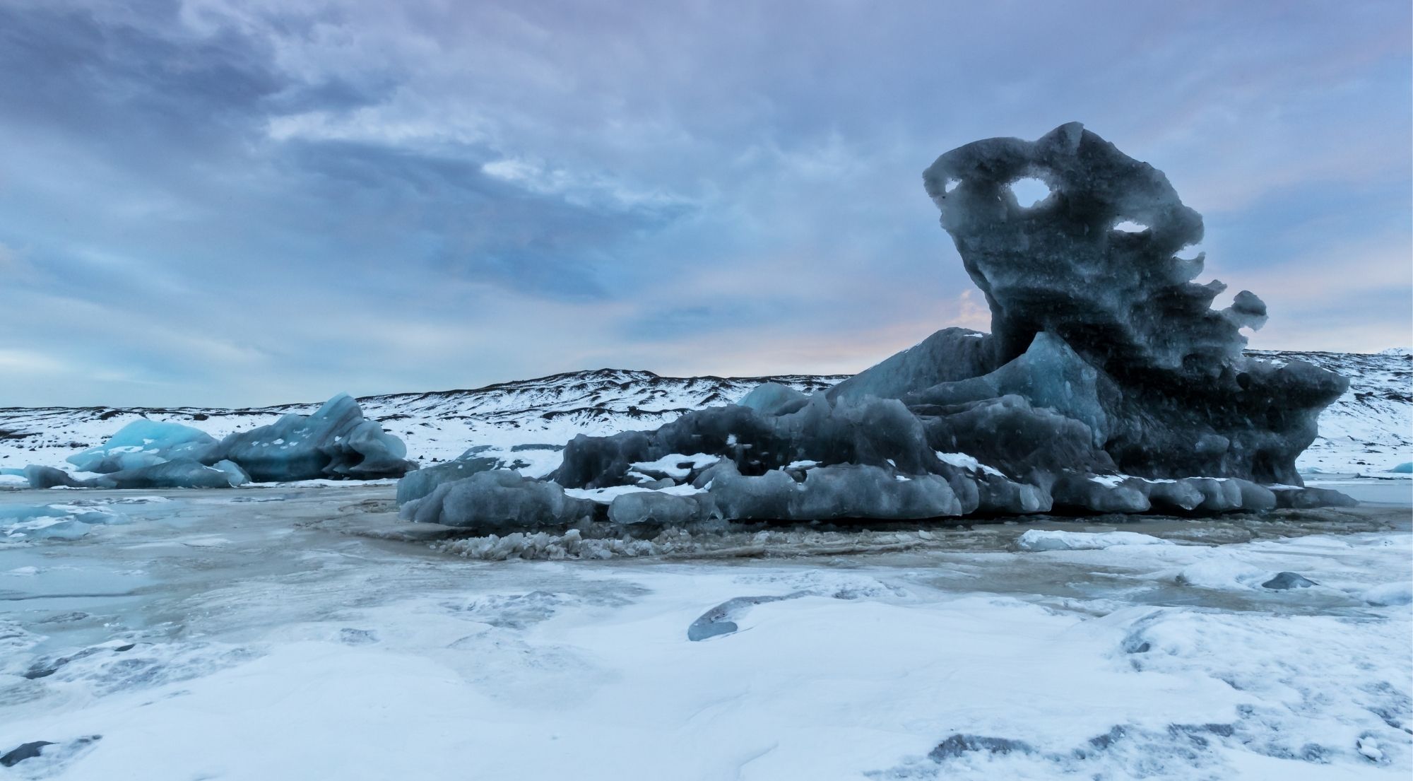 Frozen Fjallsárlón sculpture-like icebergs in January's deep winter